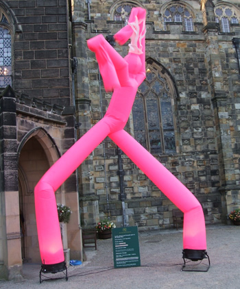 Pink illuminated air dancer